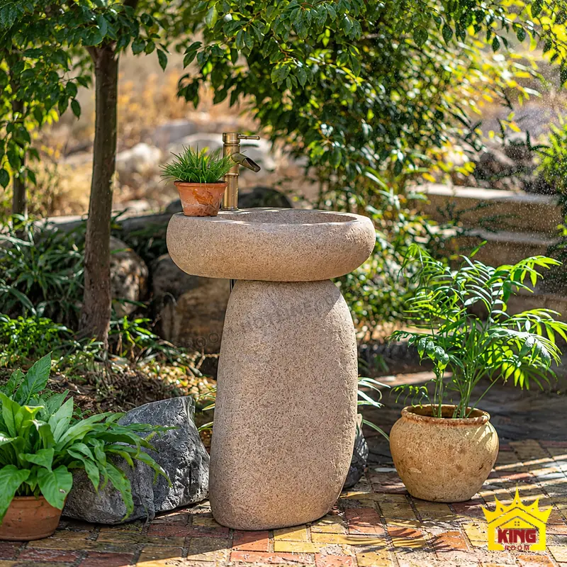 Kết cấu bộ chậu và chân đế Chậu rửa oval đá cuội tự nhiên đặt trên chân đế bo tròn với vùng tiếp giáp giữa hai phần