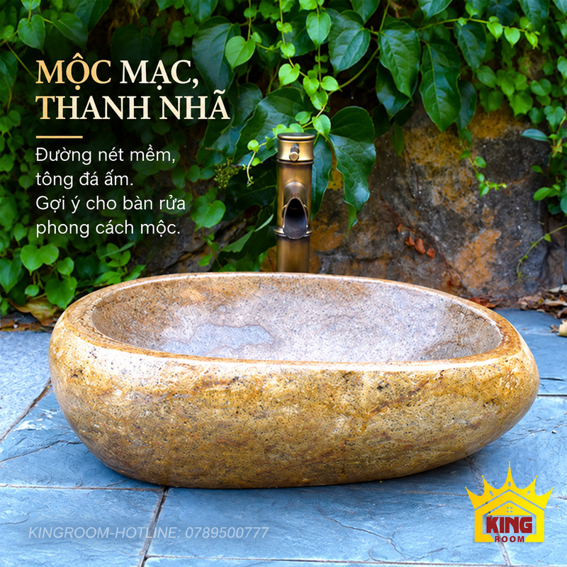 Lavabo đá cuội vàng nâu với đường nét bo mềm và vòi tông đồng