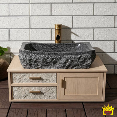 Chậu đá xám đặt trên tủ gỗ có cánh và ngăn kéo
